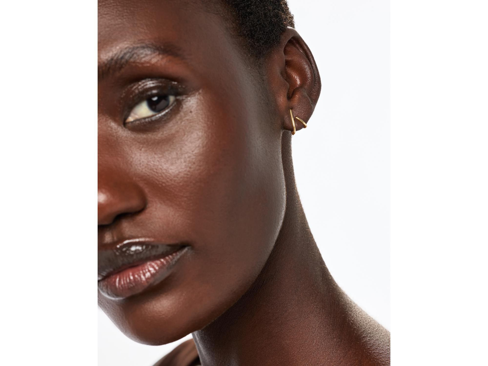 Solid Gold Aurora Huggie Studs — Image 4